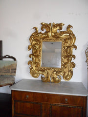Specchiera in legno intagliato e dorato. Modena XVII sec.