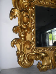 Specchiera in legno intagliato e dorato. Modena XVII sec.