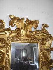 Specchiera in legno intagliato e dorato. Modena XVII sec.