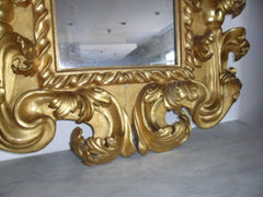 Specchiera in legno intagliato e dorato. Modena XVII sec.