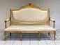 Carved and gilded sofa in gold leaf. Early 19th century