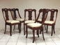 Six walnut gondola chairs. Early 19th century Lombardy