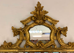 Specchiera in legno intagliata e dorata . Inizio XX secolo