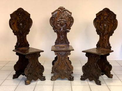 Group of three carved stools. 19th century