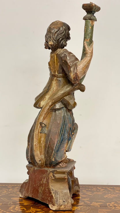 Wooden sculpture Angel holding torch. 17th century Lombardy