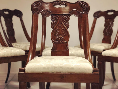Six walnut gondola chairs. Early 19th century Lombardy