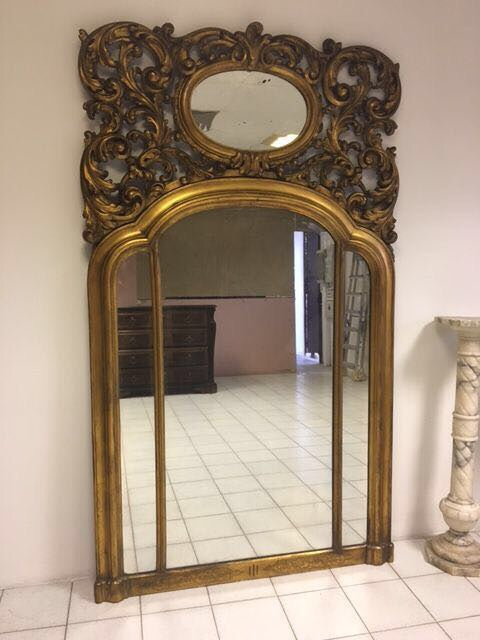 Carved and gilded wooden mirror