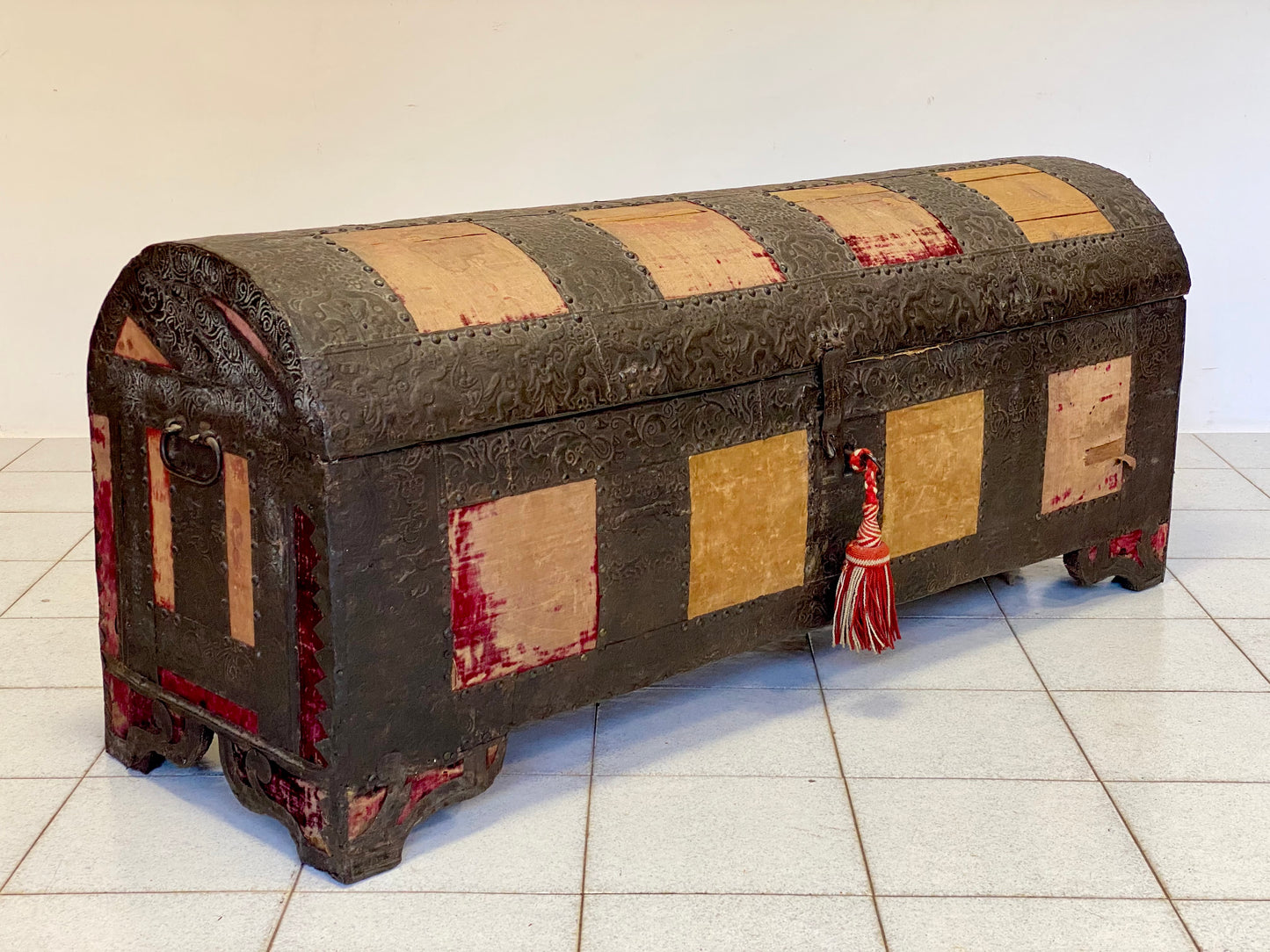 Chest covered in embossed sheet metal and velvet panels. Venice 16th century