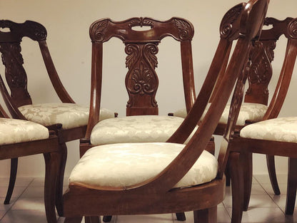 Six walnut gondola chairs. Early 19th century Lombardy