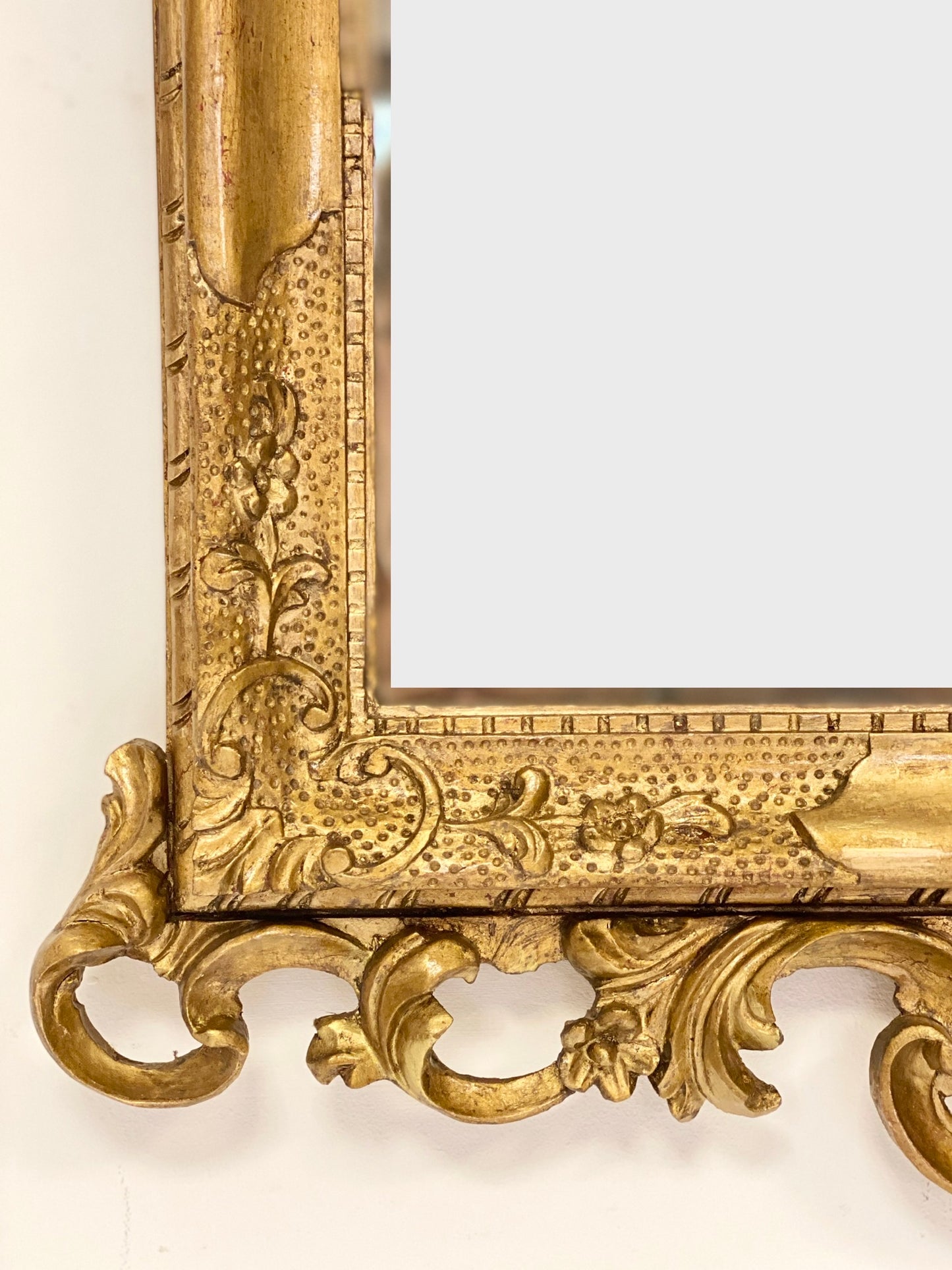 Venetian mirror in carved gilded wood. Late 19th century