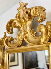 Specchiera lignea dorata con volute . Emilia XIX secolo