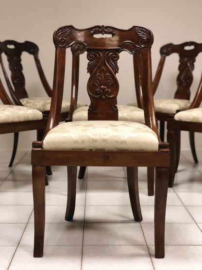 Six walnut gondola chairs. Early 19th century Lombardy