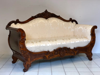 Lombard boat-shaped sofa in walnut Charles X