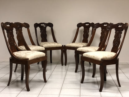 Six walnut gondola chairs. Early 19th century Lombardy