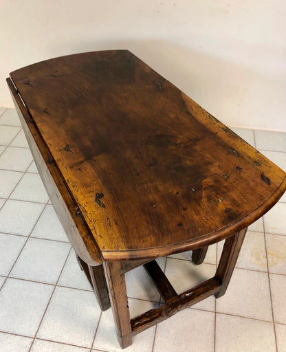 Walnut hinged table. 17th century