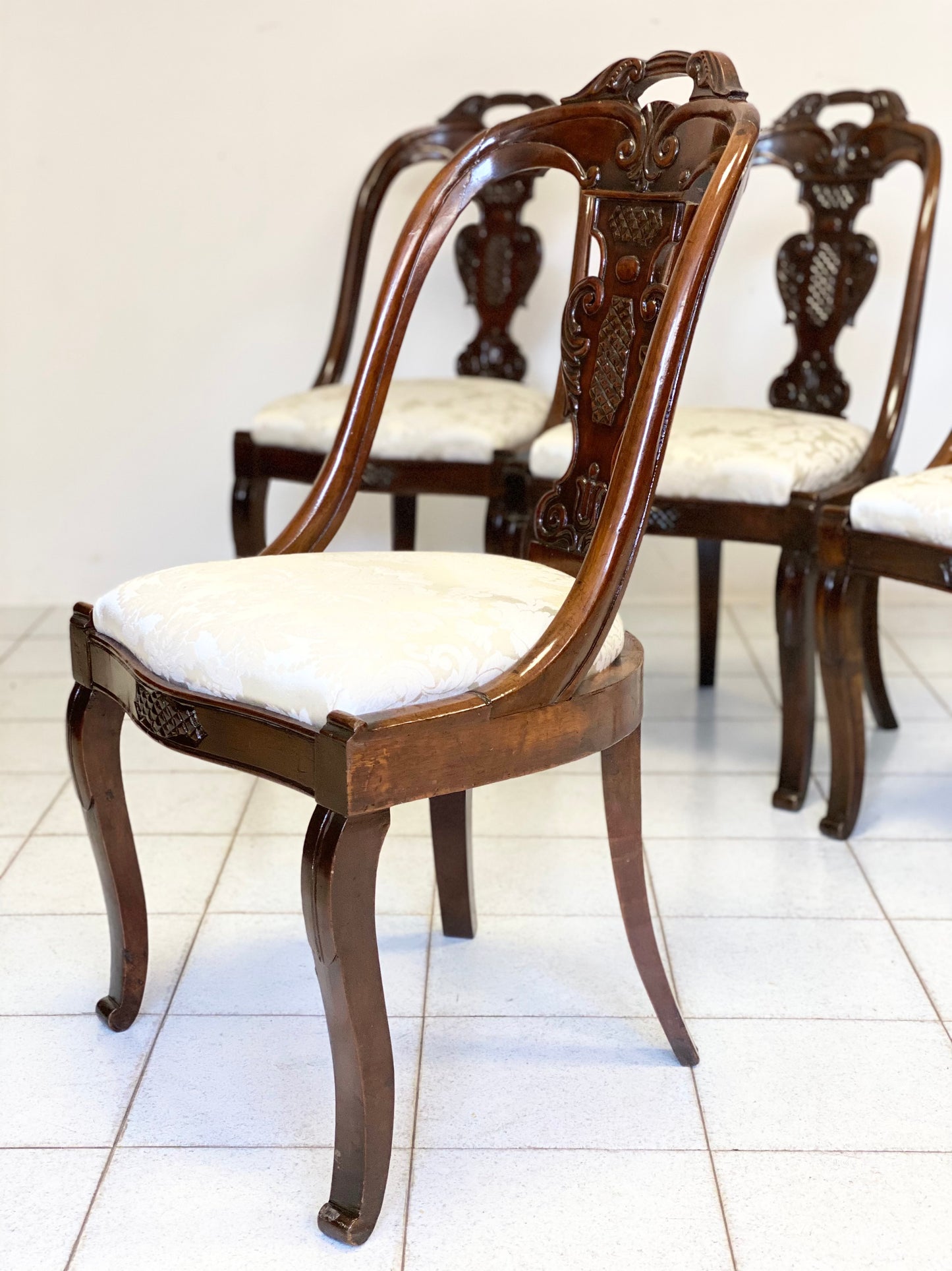 Group of four Lombard Charles X gondola empire chairs. Early 19th century