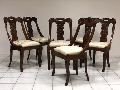 Six walnut gondola chairs. Early 19th century Lombardy