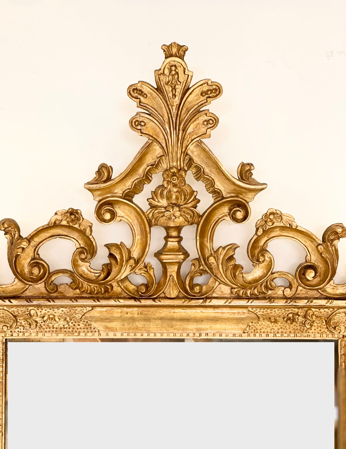 Venetian mirror in carved gilded wood. Late 19th century