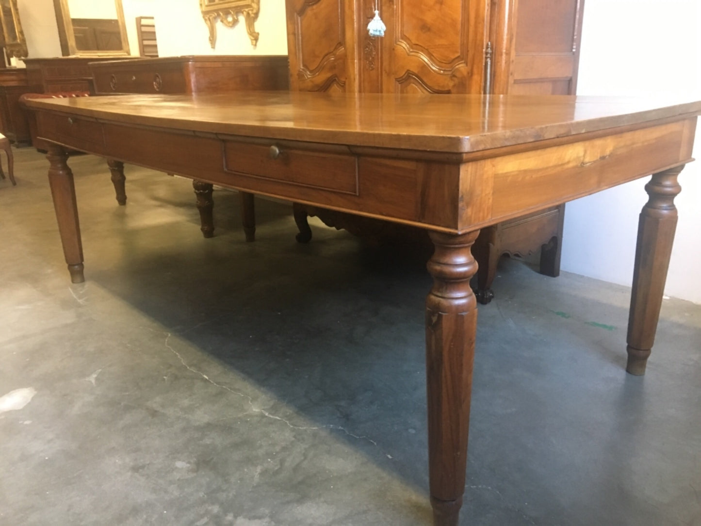 Walnut table from the Charles X era with truncated pyramid legs. 233 X 108