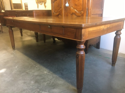 Walnut table from the Charles X era with truncated pyramid legs. 233 X 108