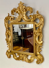 Specchiera lignea dorata con volute . Emilia XIX secolo