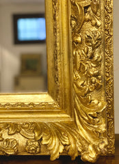 Specchiera in legno intagliato e dorato. Lombardia XIX secolo