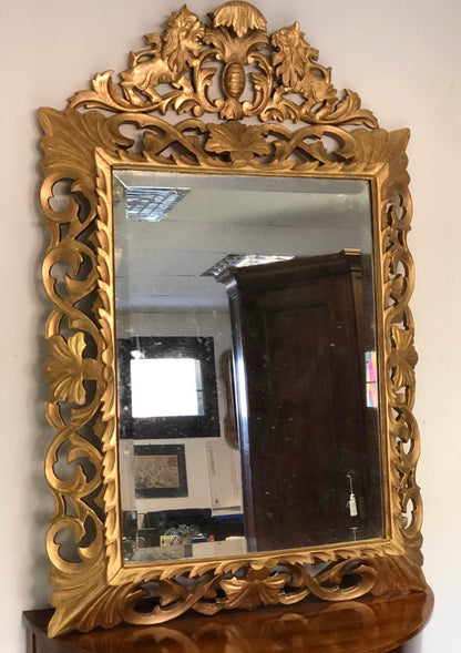 Specchiera in legno intagliato e dorato . Inizio XIX secolo