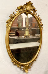 Specchiera ovale in foglia oro . Lombardia XIX secolo