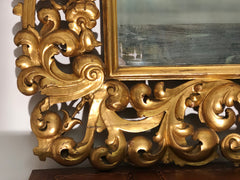 Specchiera in legno intagliato e dorato . Modena Bologna primi 700