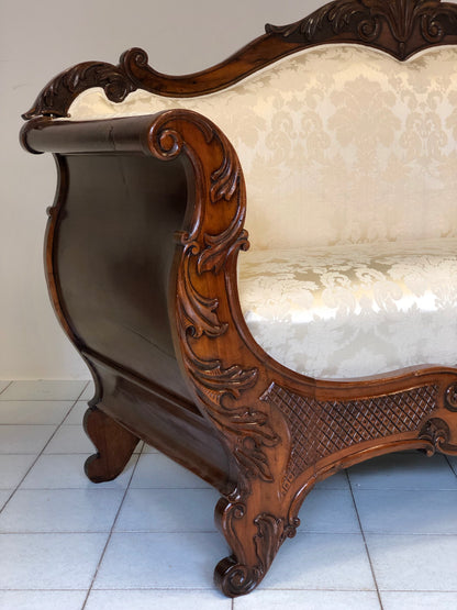 Lombard boat-shaped sofa in walnut Charles X