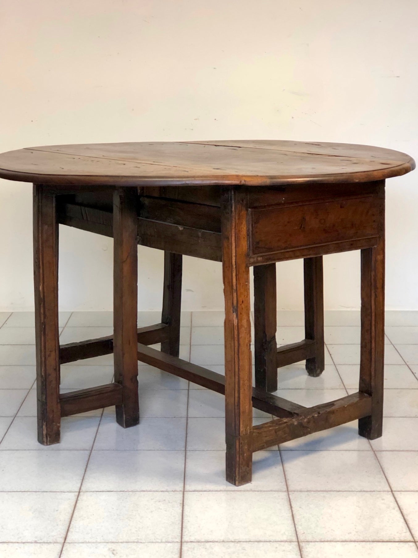 Walnut hinged table. 17th century