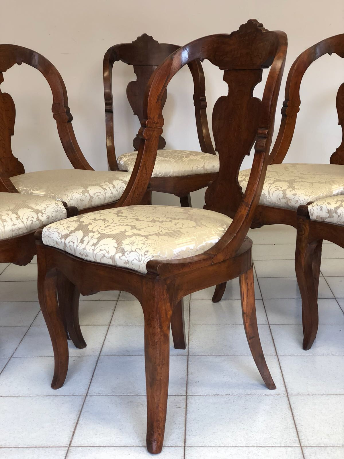 Group of six Lombard walnut gondola chairs. Charles X period