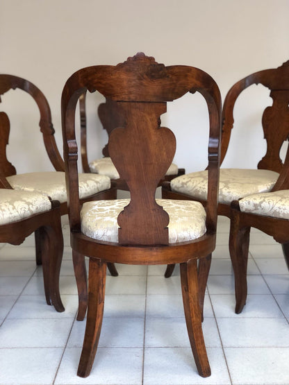 Group of six Lombard walnut gondola chairs. Charles X period