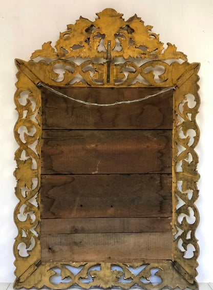 Specchiera in legno intagliato e dorato . Inizio XIX secolo