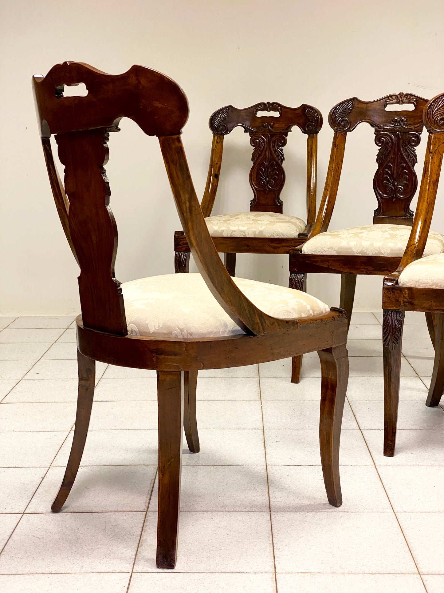 Group of four Lombard Charles X gondola empire chairs. Early 19th century