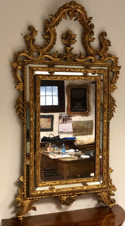 Carved and gilded wooden mirror, late 19th century