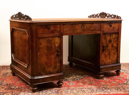 Walnut and briar center desk. Leather top