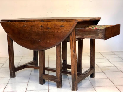 Walnut hinged table. 17th century