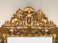 Specchiera in legno intagliato e dorato . Inizio XIX secolo