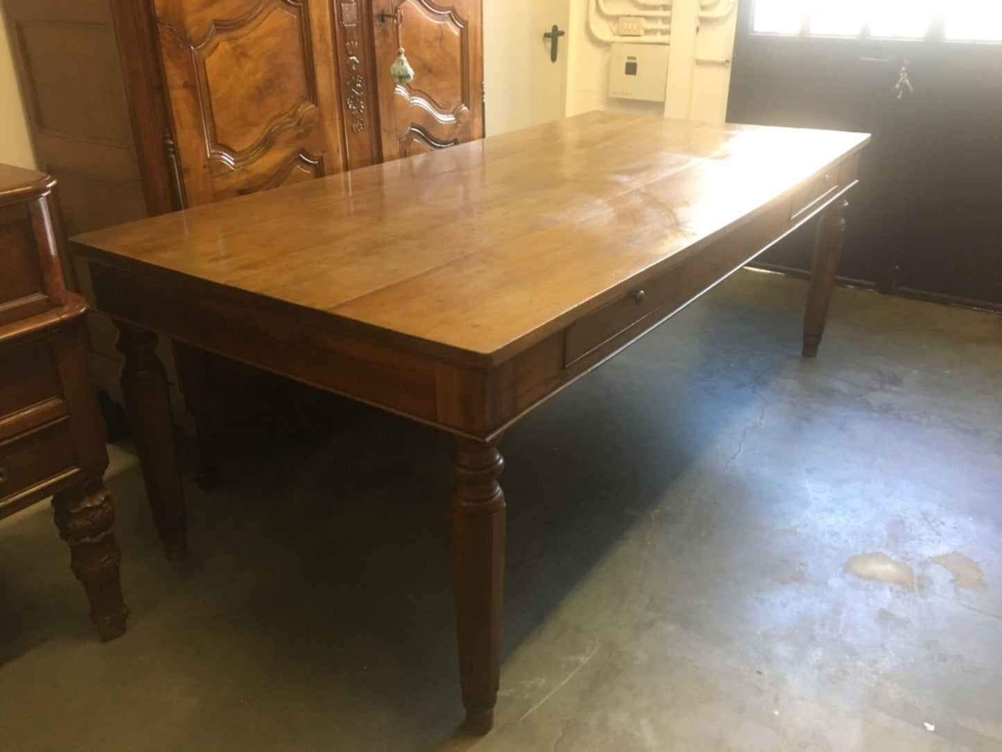 Walnut table from the Charles X era with truncated pyramid legs. 233 X 108
