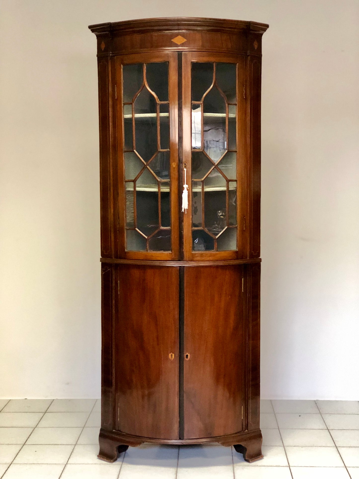 Inlaid curved corner cabinet, mid 19th century