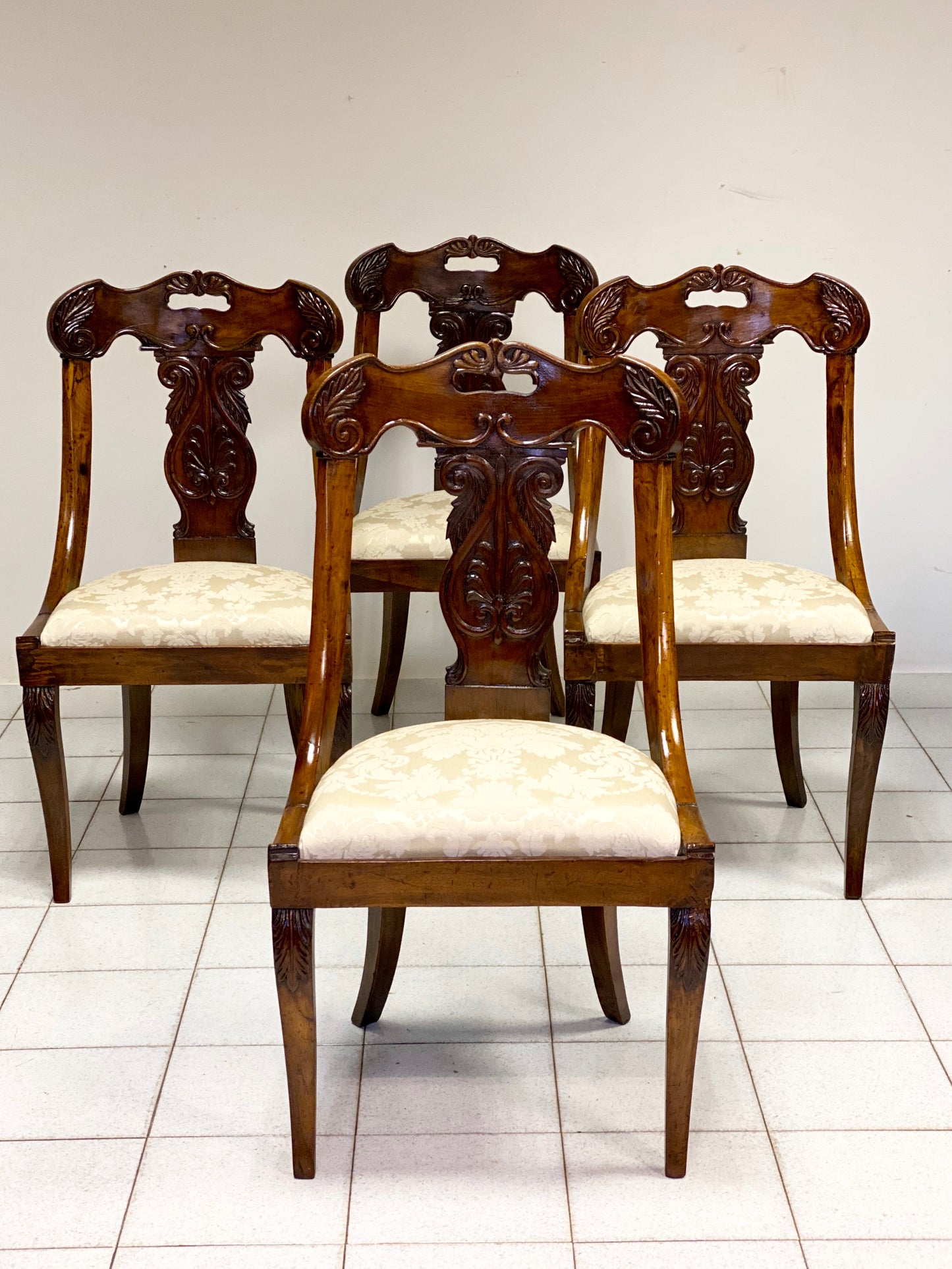Group of four Lombard Charles X gondola empire chairs. Early 19th century