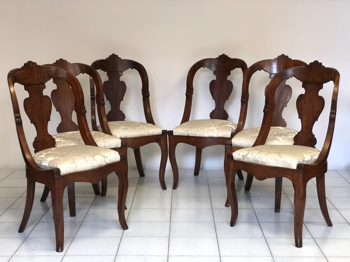 Group of six Lombard walnut gondola chairs. Charles X period