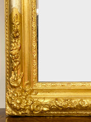 Specchiera lignea dorata con cimasa sagomata . Inizio XIX secolo