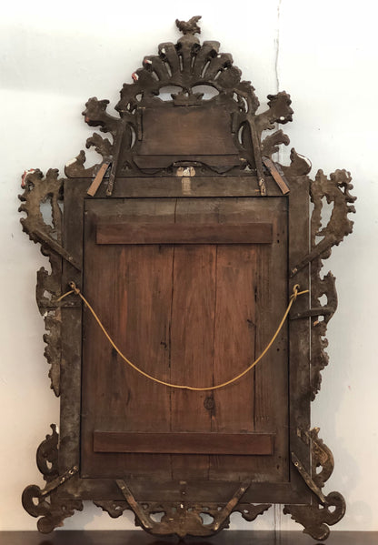 Specchiera lombarda in legno intagliata e dorata in oro zecchino