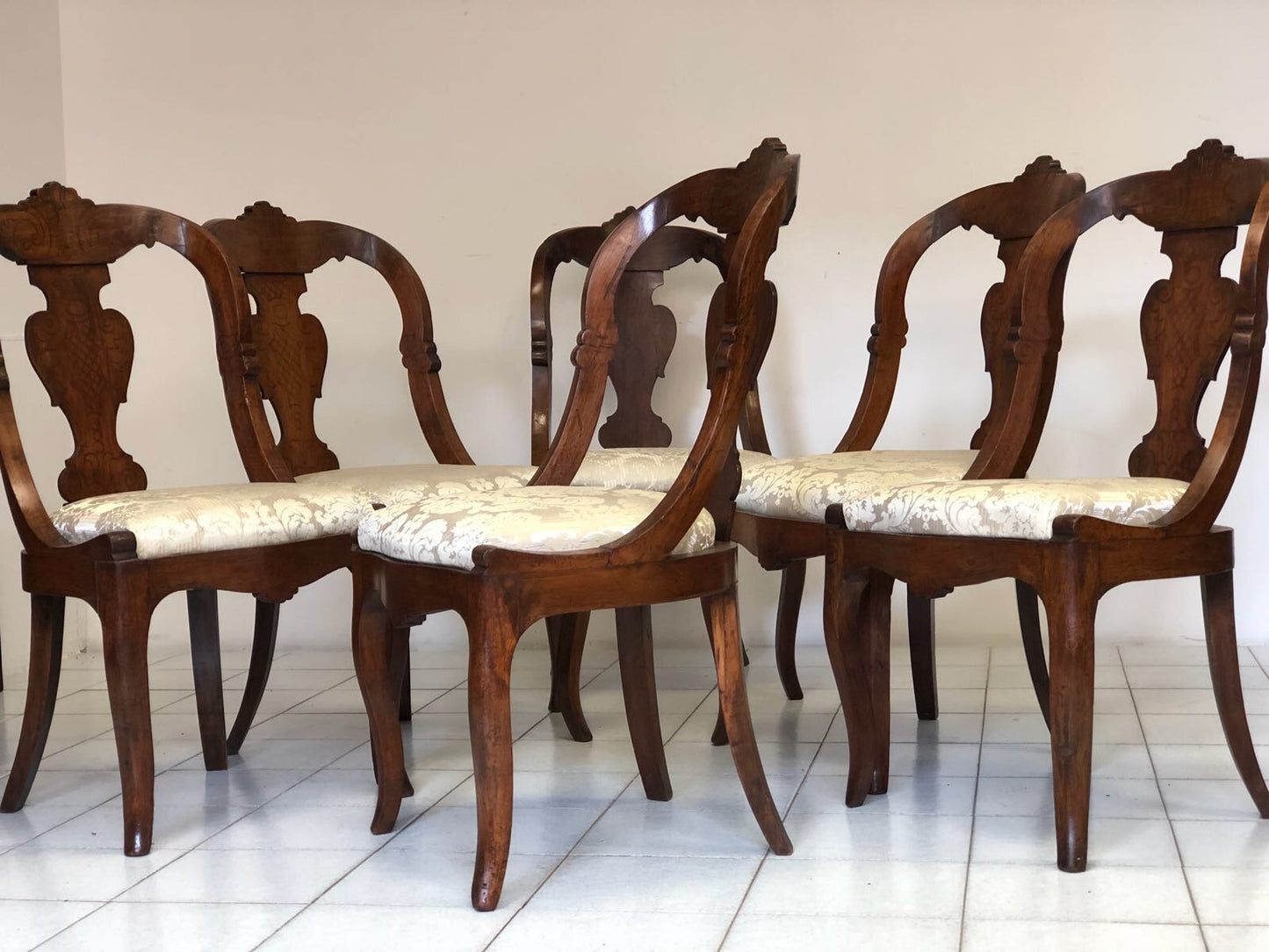 Group of six Lombard walnut gondola chairs. Charles X period