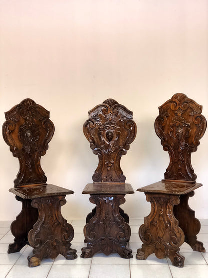 Group of three carved stools. 19th century