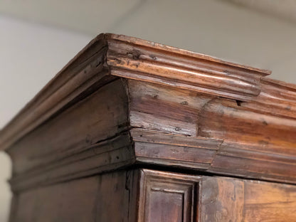 Walnut wardrobe with cloverleaf. Genoa 17th century