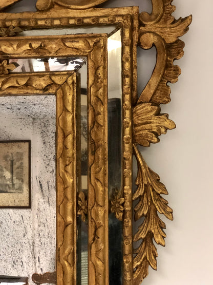 Carved and gilded wooden mirror, late 19th century