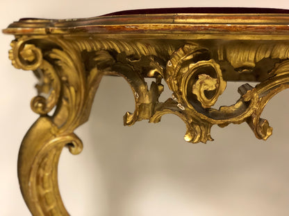 Console carved and gilded in pure gold leaf
